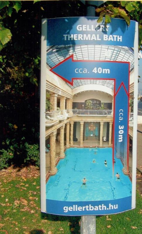 An advertisement by the St. Gellért Baths features the famous pool.