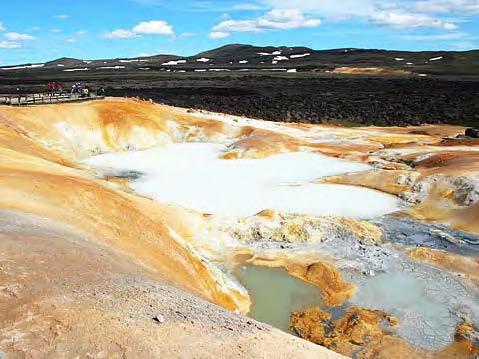 The hot springs at Leirhnjukur date from an eruption through a fissure in the mid-1970s. Note the abundant patches of native sulfur on the surrounding rocks. The hot springs, photographed in 2008, are about 2 kilometers from the Kafla power plant. During the eruption, a string of lava was produced from a geothermal well nearby. Photo and information by Ronald DiPippo