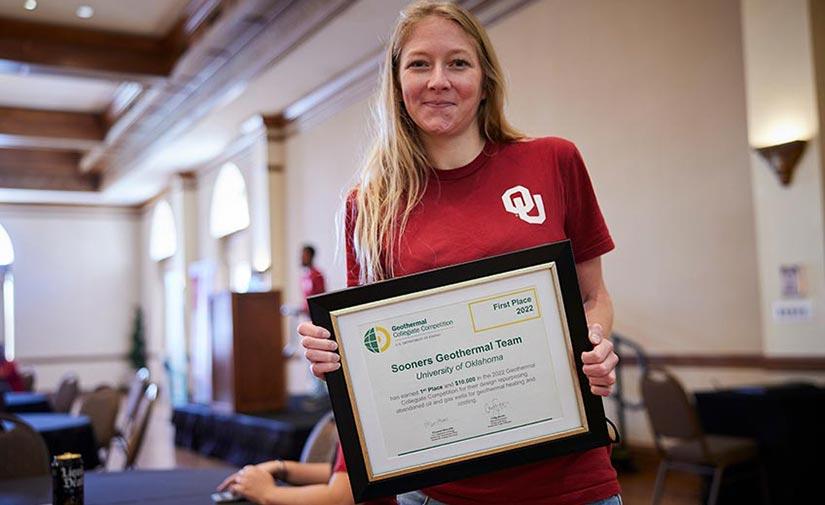 Alex Cedola shows off the Sooners Geothermal Team's first-place certificate
